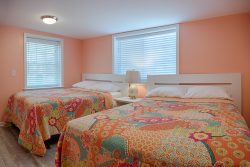 coral bedroom with whimsical bedding