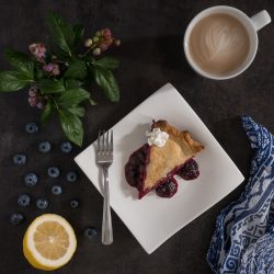 blueberry pie blueberries lemon and cup of cappaccino