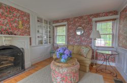 country cottage floral themed living room with fireplace