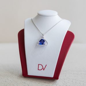 triangle sapphire necklace surrounded by diamonds